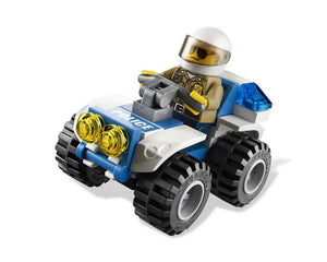LEGO City 4437 Police Pursuit ATV, white and blue, driven by a police minifigure in a white helmet, with yellow headlights and blue siren.