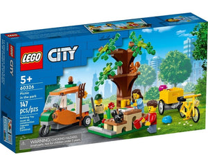 LEGO City 60326 Picnic in the Park box showing minifigures picnicking, a scooter, cargo bike, tree with squirrels, and a park worker.