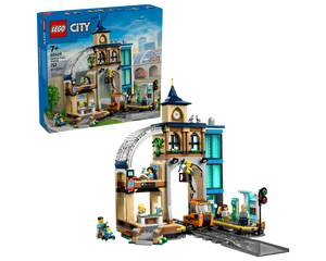 Built LEGO City 60469 Central Train Station set showing a detailed station building, track, and minifigures, with the product box.