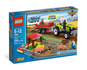 LEGO City 7684 Pig Farm & Tractor set box. Green tractor, red trailer, pig pen, three pigs, and two farmer minifigures.