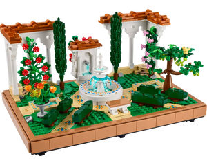 A detailed LEGO Creator 10359 Fountain Garden set featuring a central fountain, arched white pergolas, green plants, and flowers.