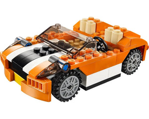 LEGO Creator 31017 Sunset Speeder, an orange convertible car with white/black stripes, clear windshield, and grey wheels.