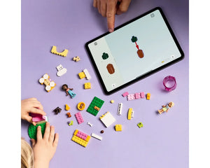 Hands build LEGO Friends Puppy Playground 42665 using a tablet's digital instructions. Bricks, minifigures, and puppies on purple.