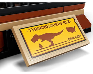Tan LEGO display plaque for a T. rex fossil exhibition, showing dinosaur silhouette, human, US map, and '68M-66M' text.