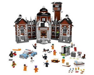 LEGO Batman Movie Arkham Asylum 70912 set with main building, watchtower, police car, and many minifigures including Batman, Joker.