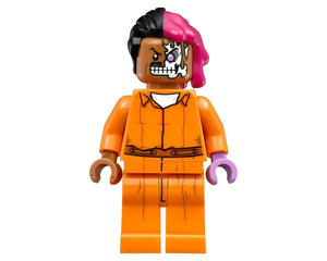 LEGO Two-Face minifigure in orange Arkham Asylum prisoner jumpsuit, with half-scarred face and black and pink hair.
