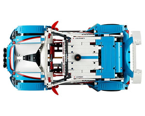 Top-down view of a blue, white, and red LEGO Technic 42077 Rally Car, showing its detailed internal structure.