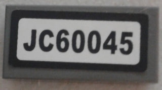 LEGO 3069pb0582 - Tegel 1 x 2 met zwart 'JC60045' patroon (sticker) - Set 60045