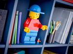 LEGO Sculptures 40649 Up-Scaled LEGO Minifigure, displayed on a bookshelf