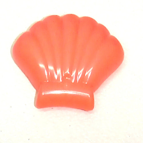 A bright orange plastic shell accessory for Friends, featuring a ridged, fan-like design and a flat base.