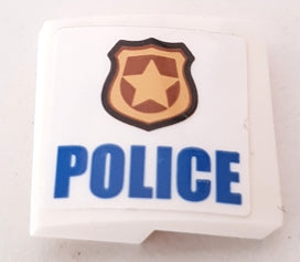 White LEGO 2x2x2/3 curved slope with a gold police badge and blue 'POLICE' text sticker.