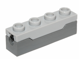 LEGO 1x4 spring shooter projectile launcher with light bluish gray top and dark gray base.