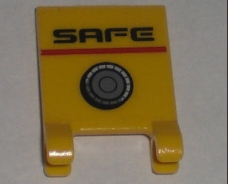 Yellow LEGO 2x2 flag part with a sticker featuring 'SAFE' text, a red line, and a grey safe dial pattern.