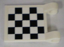 White LEGO 2x2 flag with a black and white checkered pattern on a square surface, featuring scrolled corners.