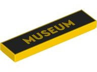 Yellow LEGO 1x4 tile with 'MUSEUM' printed in gold text on a black rectangular background.
