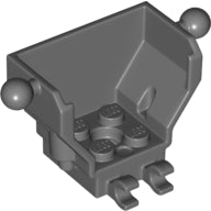 Dark grey LEGO cockpit 4x2x3 brick with two tow balls on the sides, two clips at the front, and four studs on the base.