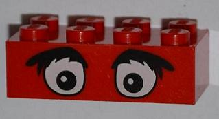 Red LEGO 2x4 brick with cartoon eyes and bushy black eyebrows printed on one side, featuring eight studs on top.