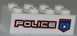 White LEGO 2x4 brick with 'POLICE' in white text with red outline, and a blue shield badge with a white star.