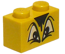 Yellow LEGO 1x2 brick with a black and white angry eyes and black hair pattern printed on one side.