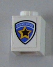 White LEGO 1x1 brick with a blue, yellow, and black shield sticker featuring a star and 'HIGHWAY PATROL' text.