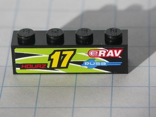 Black LEGO 1x4 brick with lime flames sticker, yellow '17', red 'HOURZ' and 'eRAV', blue 'RUSA' text.