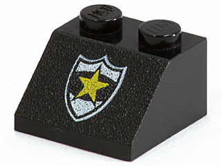 Black LEGO Slope 45 2x2 brick with a white-outlined shield and yellow star police badge pattern.