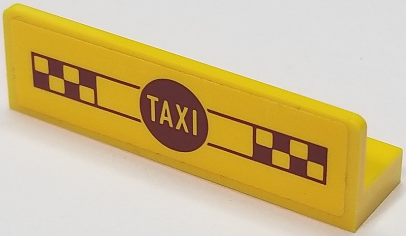 Yellow LEGO 1x4x1 panel featuring 'TAXI' in a dark red circle and checkered patterns.