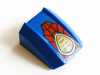 Blue LEGO curved slope 2x2 with lip, featuring a red web pattern and a white oval with yellow and white headlight design.
