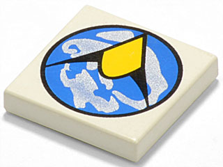 A tan LEGO 2x2 tile with the Exploriens logo: a blue circle containing white shapes and a black angular design with a yellow diamond.