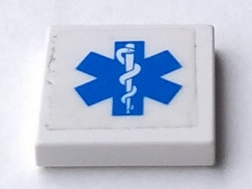 White LEGO 2x2 tile with a blue EMT Star of Life symbol sticker applied to its top surface.