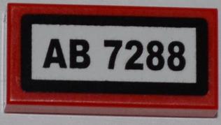 A red LEGO 1x2 tile with a white rectangle, black border, and black text 'AB 7288'.