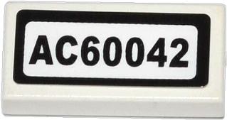 A white LEGO 1x2 tile with a black-bordered sticker displaying 'AC60042' in black text.