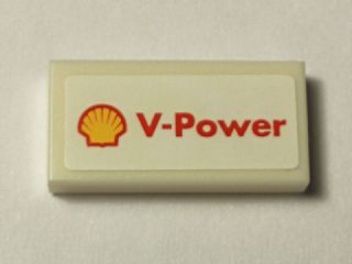 LEGO 3069pb0345 Tile 1x2, light tan, with a white sticker showing the red and yellow Shell logo and 'V-Power' text.
