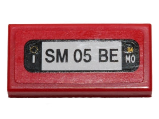 Red LEGO 1x2 tile with 'SM 05 BE' license plate pattern sticker, showing 'MO' and '04'.