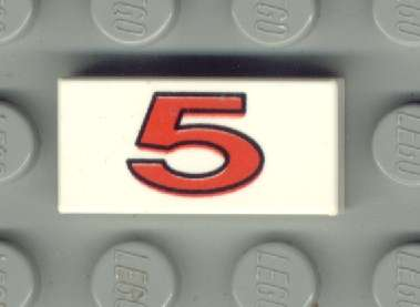White LEGO 1x2 tile with a bold red number 5 pattern printed on it, resting on a gray LEGO baseplate.