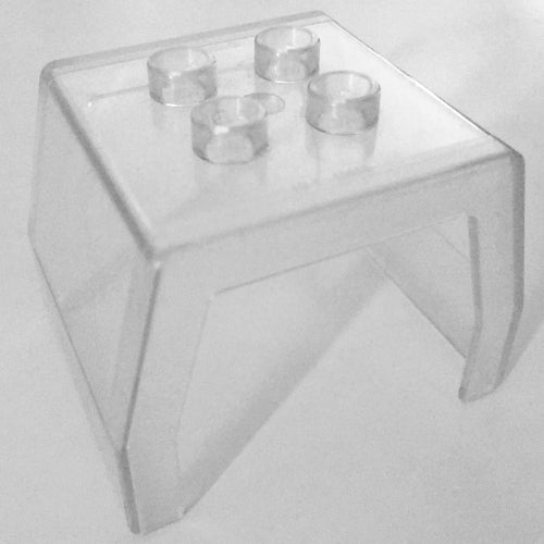 Clear plastic LEGO Duplo 31302 train passenger compartment cover with four studs on top.