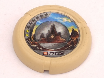Beige LEGO throwing disk 32171pb043, featuring Slizer Rock emblem with 2 pips, LEGO Technic logo, and rock silhouette pattern.