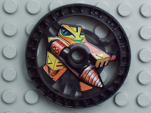 LEGO 32355pb01 Technic 5x5 Disk, RoboRider Talisman Wheel. Black disk with Driller Mold robot pattern in yellow and orange.