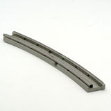 Close-up of a gray LEGO 12V curved train track with two conducting rails on a white background.