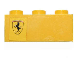 Yellow LEGO 1x3 brick with a Ferrari logo sticker on the left side, part 3622pb055L from LEGO set 30194.