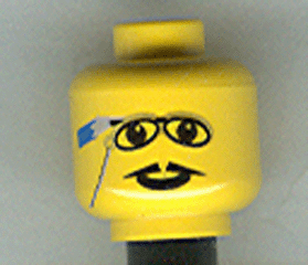 Yellow LEGO minifigure head with printed glasses, pointed mustache, and a pencil pattern behind one ear.