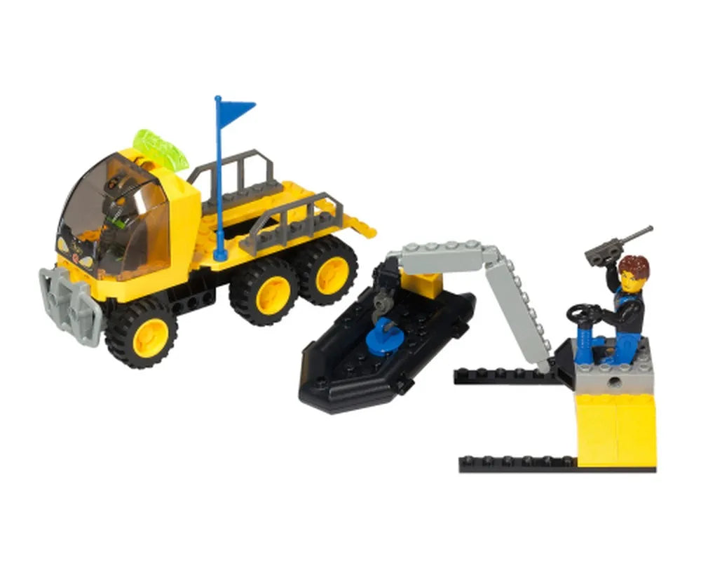 LEGO 4 Juniors 4606 Aqua Res-Q Transport set featuring a yellow 6-wheel truck, black boat, crane, and minifigure.