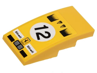 Yellow LEGO curved 4x2 slope piece with Ferrari and Shell logos, number 12 in a white circle, and car intake patterns.