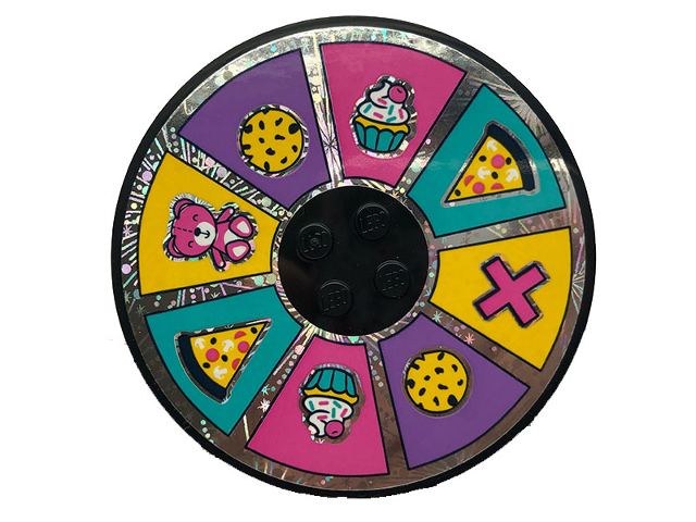 Round LEGO 8x8 tile with Wheel of Fortune sticker: pizza, cookie, cupcake, bear, plus sign icons in colorful segments.