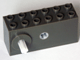 Dark gray LEGO 42073c02 Windup Motor 2x6x2 1/3 with raised shaft base and white long axle. Top has 12 studs.
