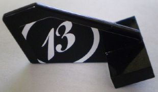 Black LEGO 44661pb011R Tail Shuttle, Small piece with white '13' and partial circle sticker on the right side.
