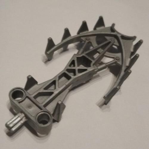Gray LEGO Bionicle 47317 weapon piece, a crystal spike with curved, spiky arms and connection points.