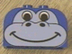 Blue LEGO Duplo curved slope brick with a light grey gorilla or dinosaur face pattern, black eyes and a smile.