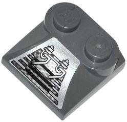 Dark gray LEGO curved slope 2x2 with two studs and silver sticker featuring grille and mechanical barbell pattern.