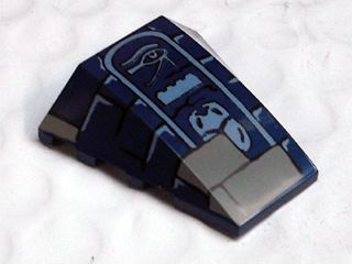 Dark blue LEGO 4x4 triple curved wedge piece featuring Eye of Horus, LEGO brick, and scarab hieroglyphs.